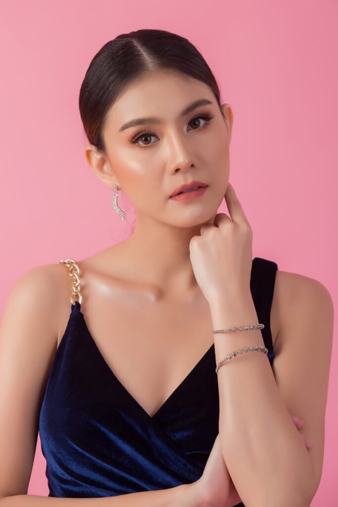 beautiful woman face. hand of make up